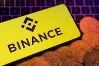 FILE PHOTO: Smartphone with displayed Binance logo and representation of cryptocurrencies are placed on a keyboard in this illustration taken, June 8, 2023. REUTERS/Dado Ruvic/Illustration/File Photo