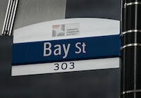 A street sign along Bay Street in Toronto's financial district  is shown  on Tuesday, January 12, 2021. THE CANADIAN PRESS/Nathan Denette