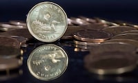 Canadian dollar coins are displayed in Montreal, Friday, January 30, 2015.