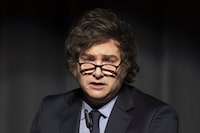 Argentina's President Javier Milei speaks after receiving this year's Roepke Prize for Civil Society of the Liberal Institute at the Congress centre in Kloten, Switzerland, Friday, Jan. 24, 2025. (Ennio Leanza/Keystone via AP)